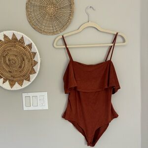 Suede style burnt orange body suit